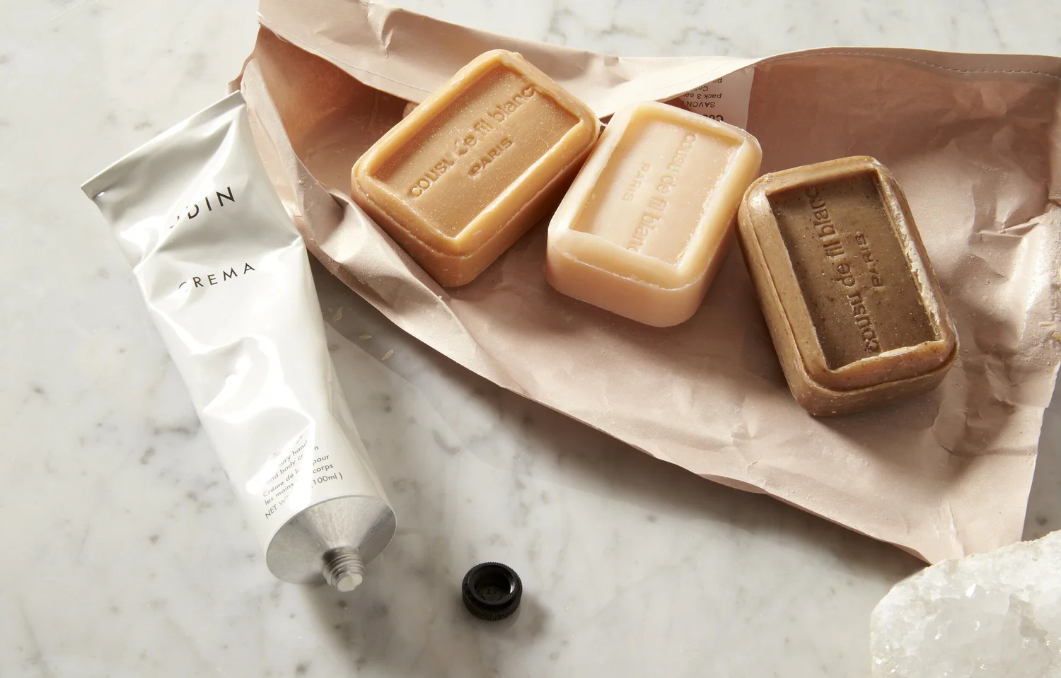 Soaps and hand cream on marble