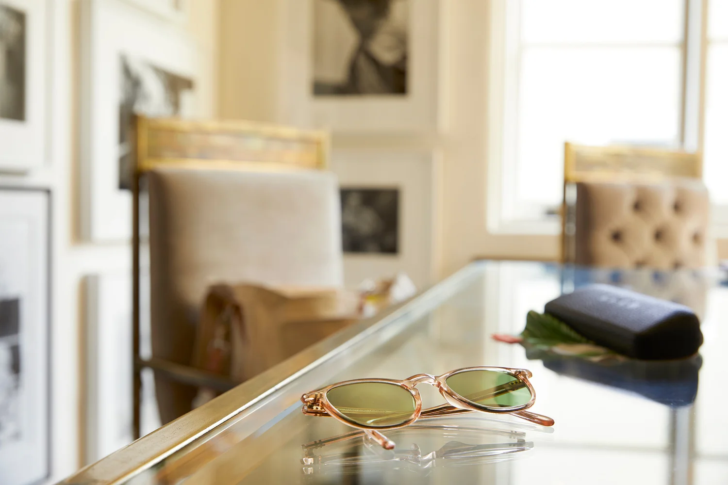 Garrett Leight sunglasses on a glass table