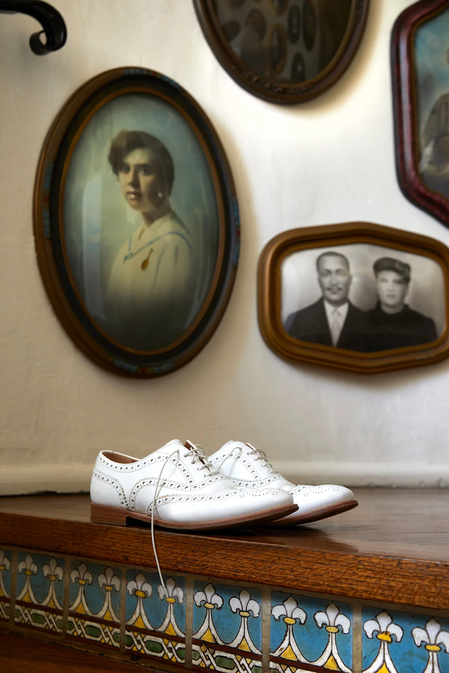 White brogues on tiled ledge