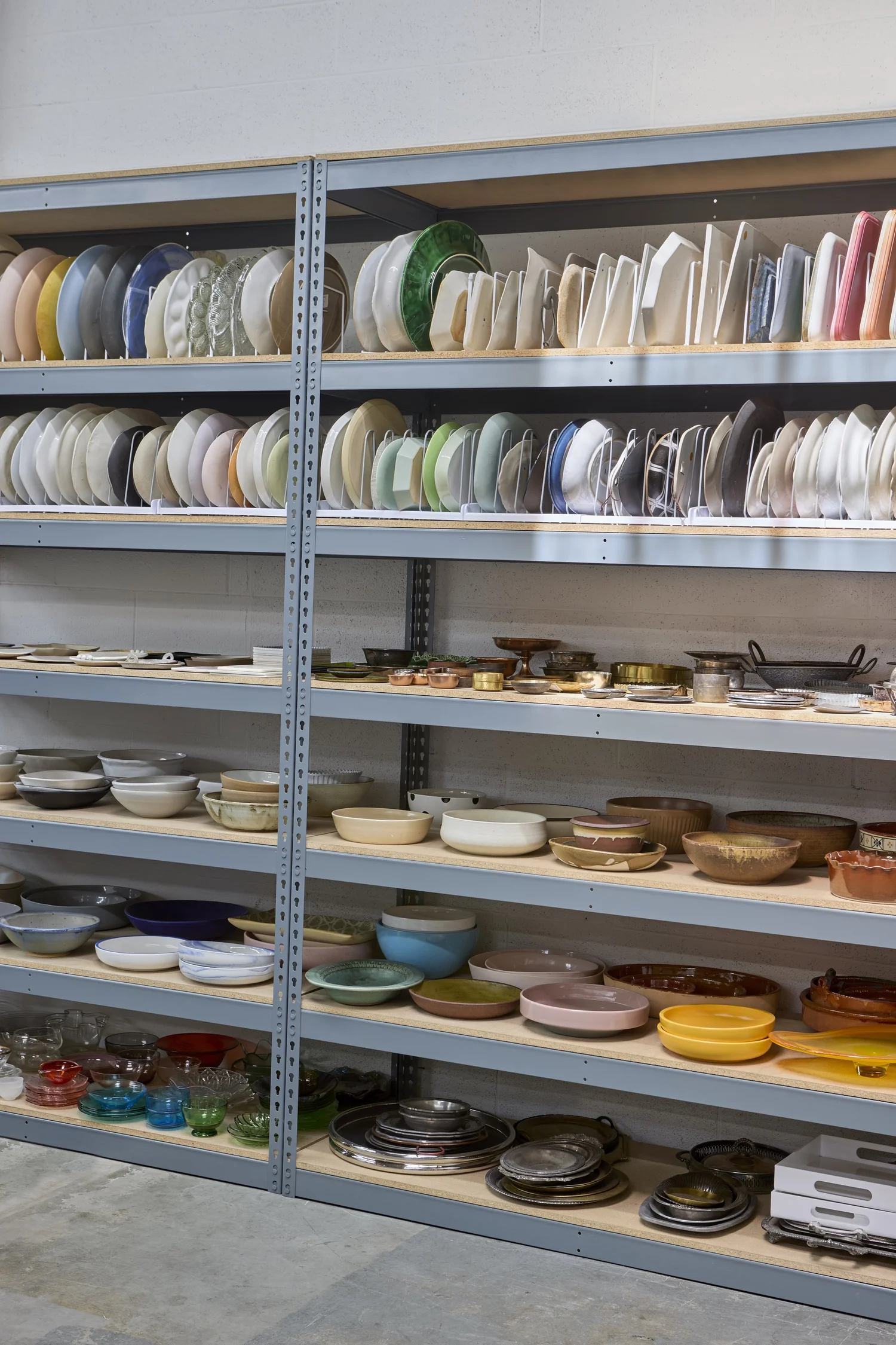 Shelving with plates, bowls, and glassware