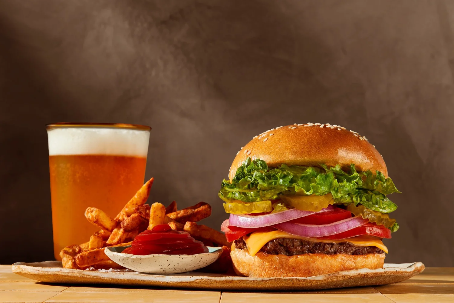 Cheeseburger with fries and beer